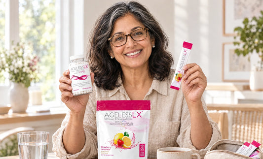 Woman in her early 50s comparing an AgelessLX Strawberry Lemonade stick pack and an AgelessLX capsule bottle at a dining table with the AgelessLX pouch